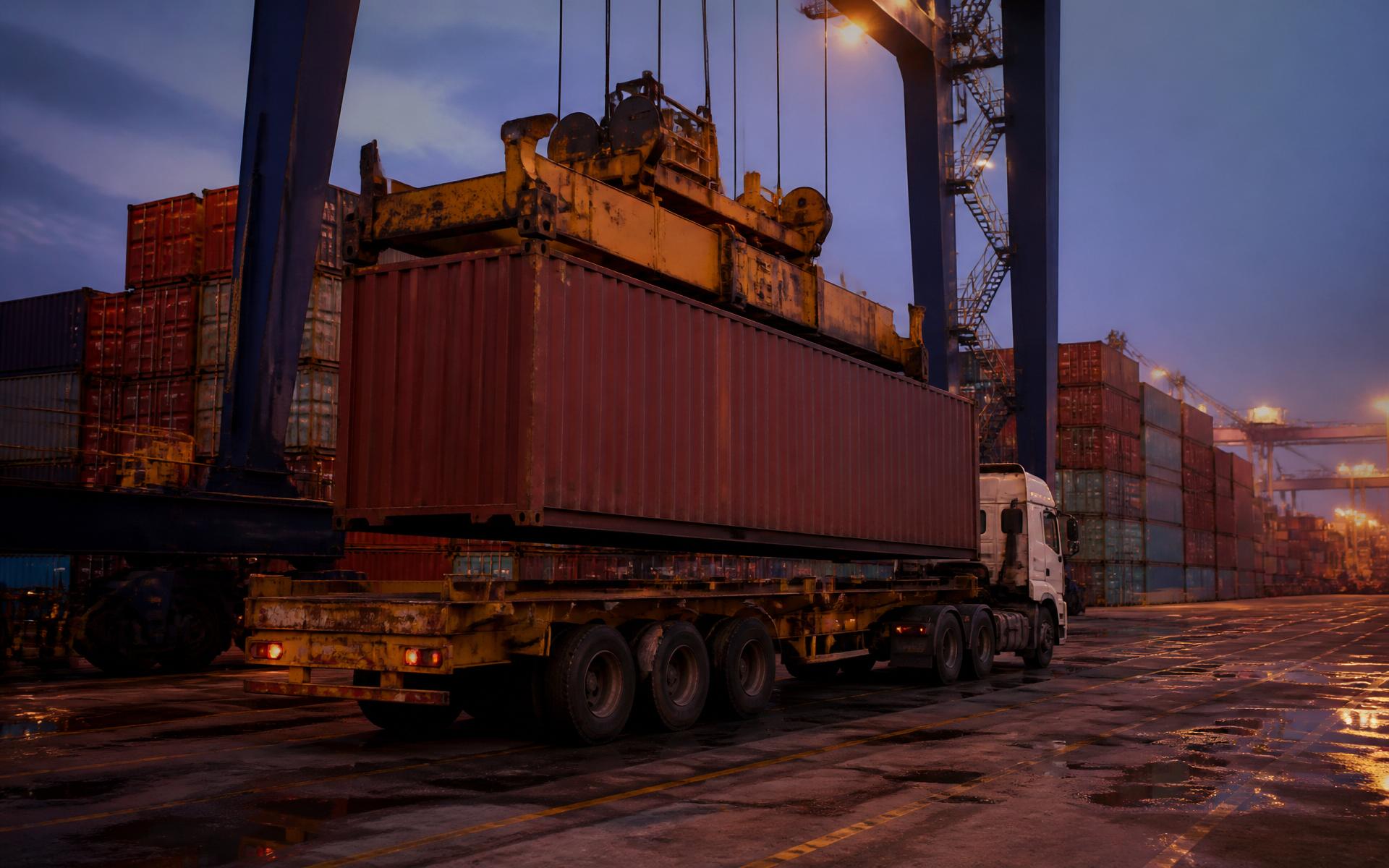 Container being lowered onto a trailer at an Indian shipping port